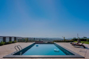 Breezy Whispers by StayVista - Private infinity pool, Stunning mountain views, Spacious swimming pool, Deck & Lawn
